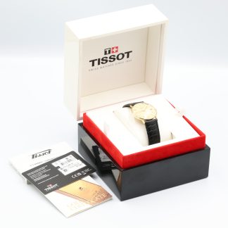 Tissot kultakuorinen rannekello 18K, kaiverrus takakannessa, ei käy, laatikko, paperit